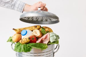 Silver bin filled with food waste